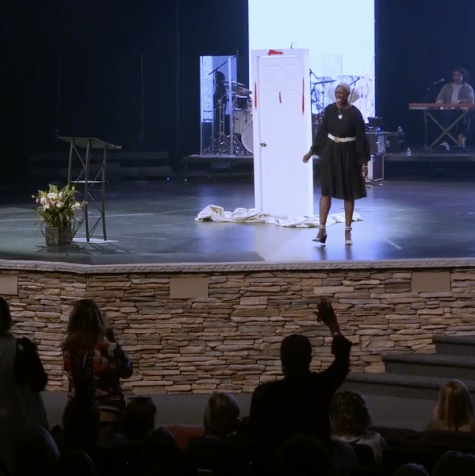 Lily speaking at an event
